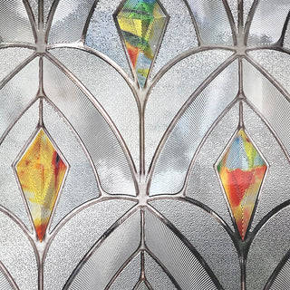 Close-up of the Peacocks scalloped pattern and colored diamonds